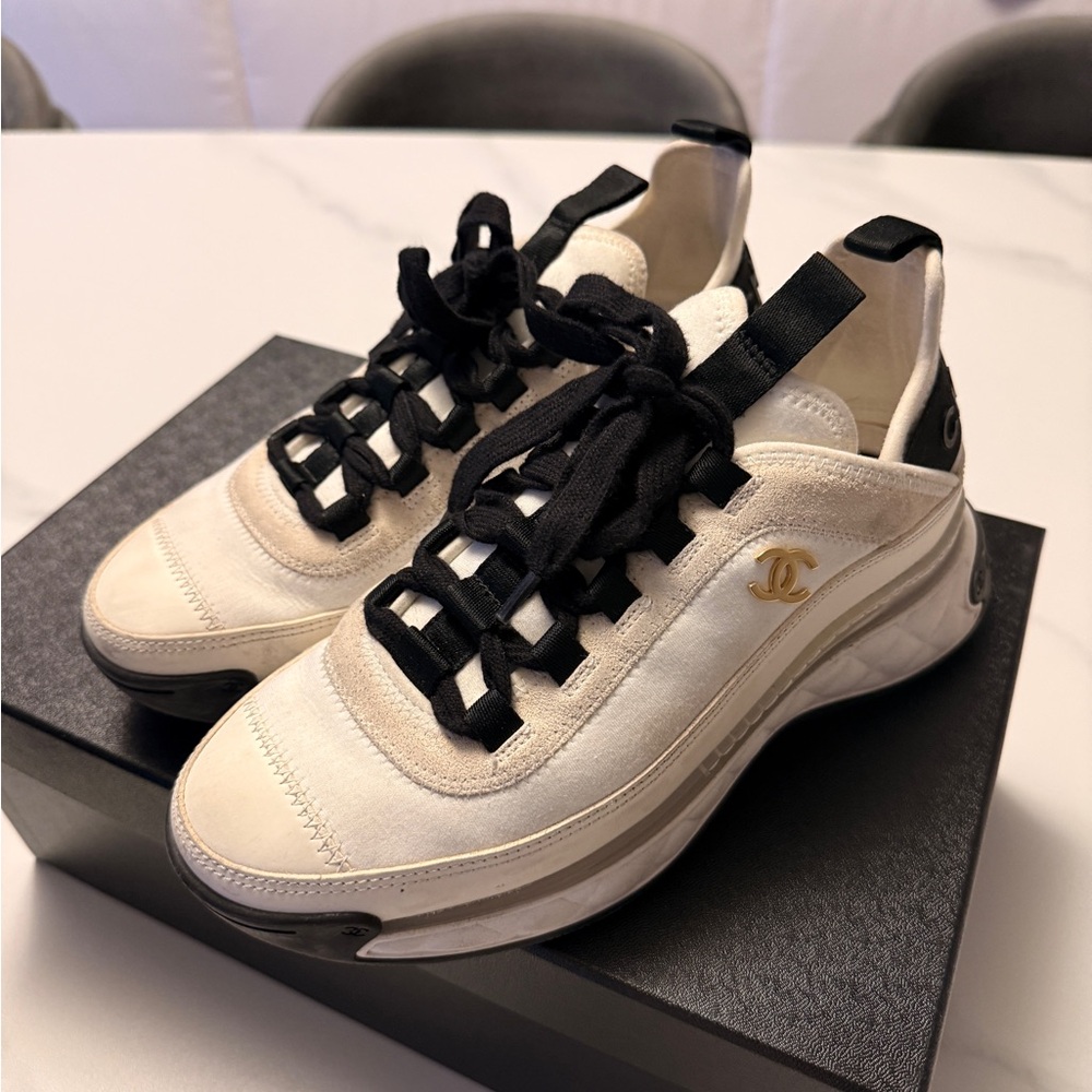 CHANEL Cream and Black Sneakers with Modern Silhouette